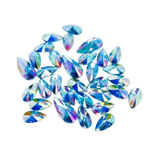 Ice blue face gems for festivals and parties. Apply with a cosmetic fixative. Iridescent blue face and body gems that are reusable