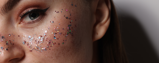 a woman with glitter freckles