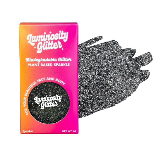 Luminosity Glitter packaging with a black glittery glove on a white background