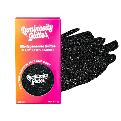 Luminosity Glitter packaging with black glittery gloves on a white background