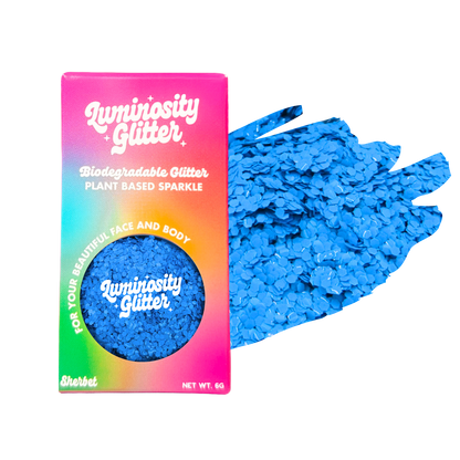 Blue glitter with Luminosity Glitter packaging on a white background