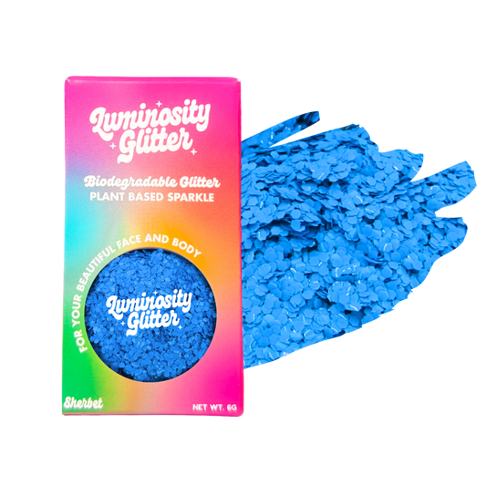 Blue glitter with Luminosity Glitter packaging on a white background
