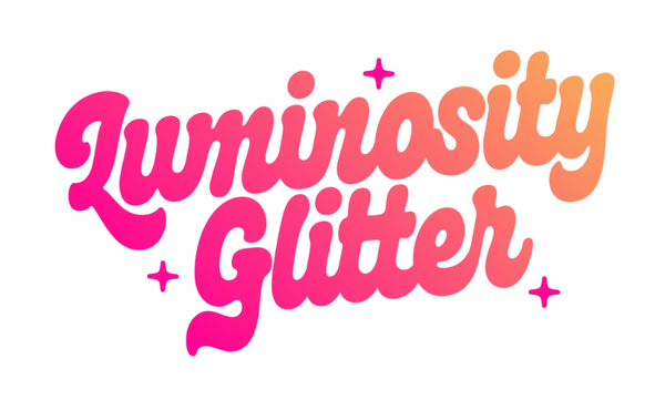 The words 'Luminosity Glitter' written in a playful cursive font with a pink-to-orange gradient, accented by small pink sparkle stars on a plain white background.