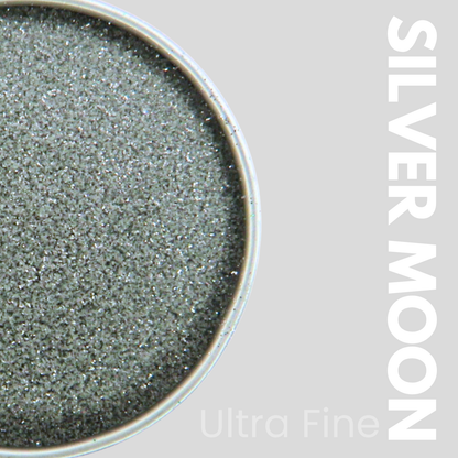 Silver glitter in a container with 'Silver Moon' text on a gray background