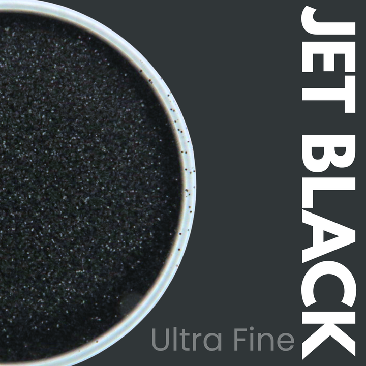 Ultra fine jet black glitter powder in a container with &