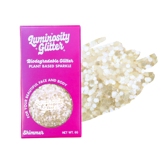 Biodegradable glitter packaging with glitter on a white background