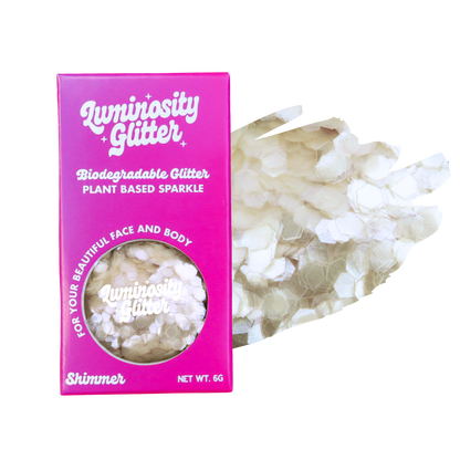 Luminosity Glitter packaging with biodegradable glitter on a white background