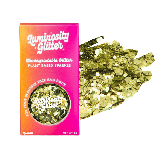Luminosity Glitter packaging with gold glitter on a white background
