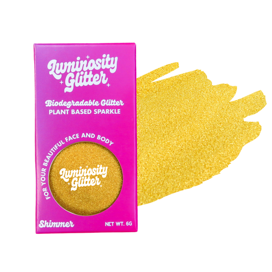 Luminosity Glitter packaging with a sample of gold glitter on a white background