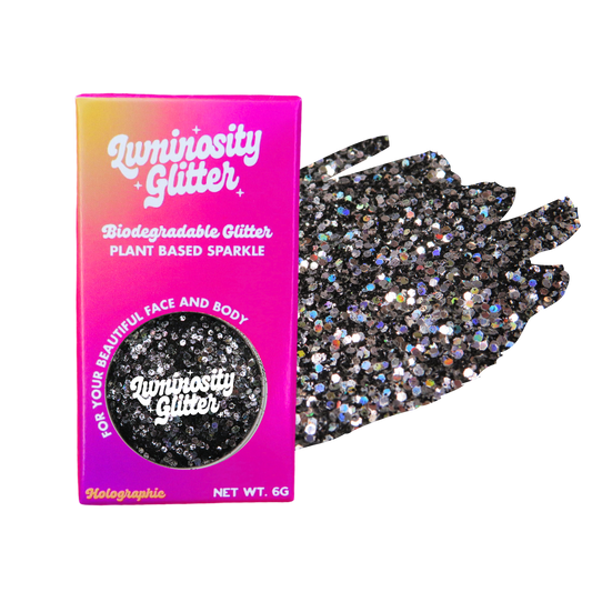 Luminosity Glitter packaging with a black glittery glove on a white background