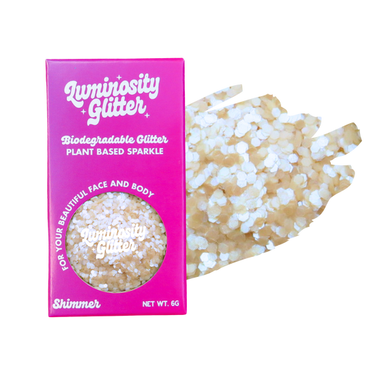 Biodegradable glitter packaging with a sample of glitter on a white background