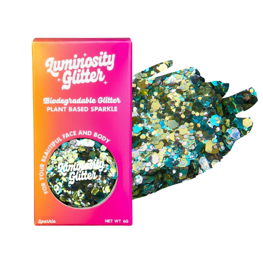 Luminosity Glitter packaging with biodegradable and plant-based sparkle, featuring a colorful gradient.