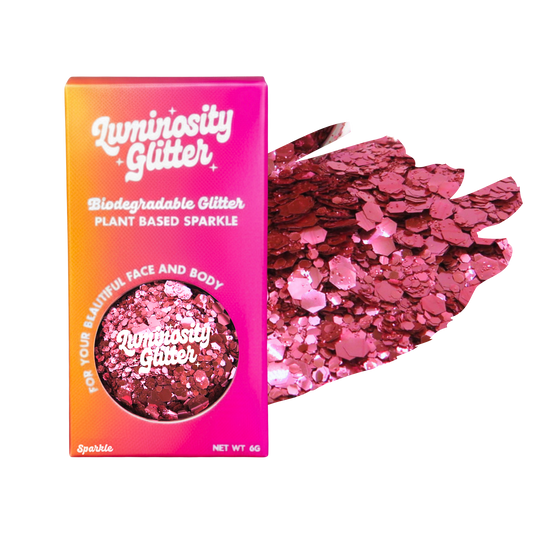 Luminosity Glitter packaging with pink glitter on a white background