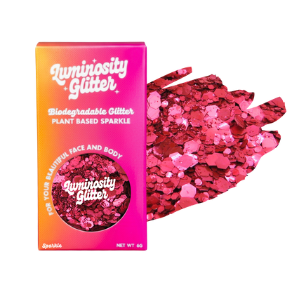 Luminosity Glitter packaging with pink glitter on a white background