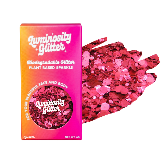 Luminosity Glitter packaging with pink glitter on a white background