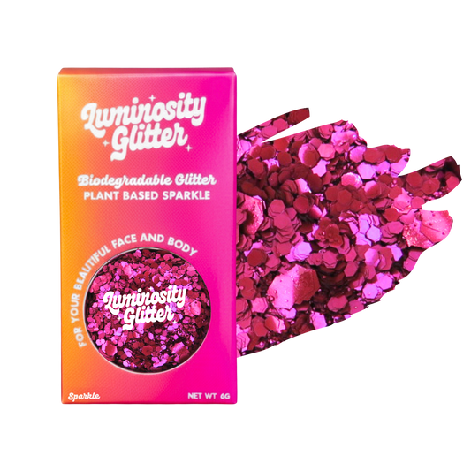 Luminosity Glitter packaging with pink and red glitter on a white background