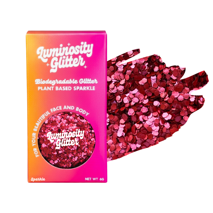Luminosity Glitter packaging with red and pink glitter on a white background