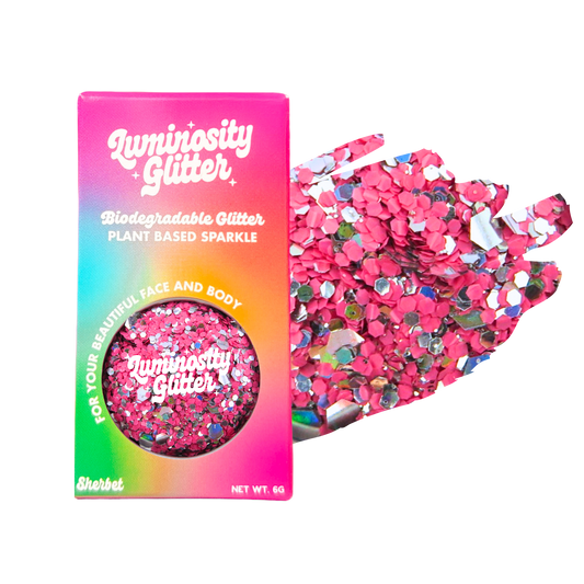 Luminosity Glitter packaging with pink glitter on a white background