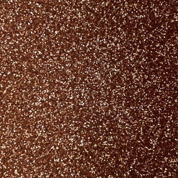 Close-up of rose gold fine eco glitter texture.