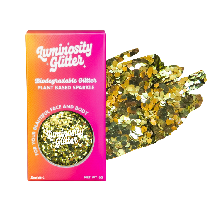 Luminosity Glitter packaging with gold glitter on a white background