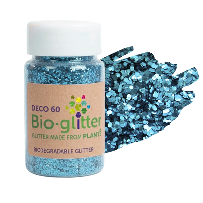 A bottle of blue chunky craft biodegradable glitter next to a fan of loose blue glitter flakes, on a solid white background. The label reads 'DECO 60 Bio-glitter GLITTER MADE FROM PLANTS'.