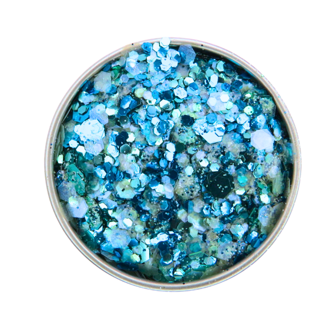 Blue glitter in a small round container on a white background
