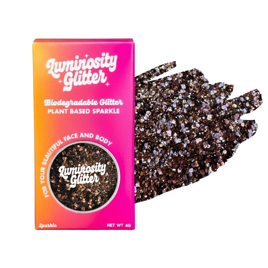Luminosity Glitter packaging with biodegradable and plant-based glitter on a white background