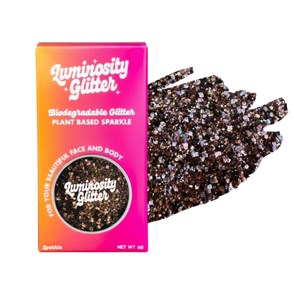 Luminosity Glitter packaging with biodegradable and plant-based glitter on a white background