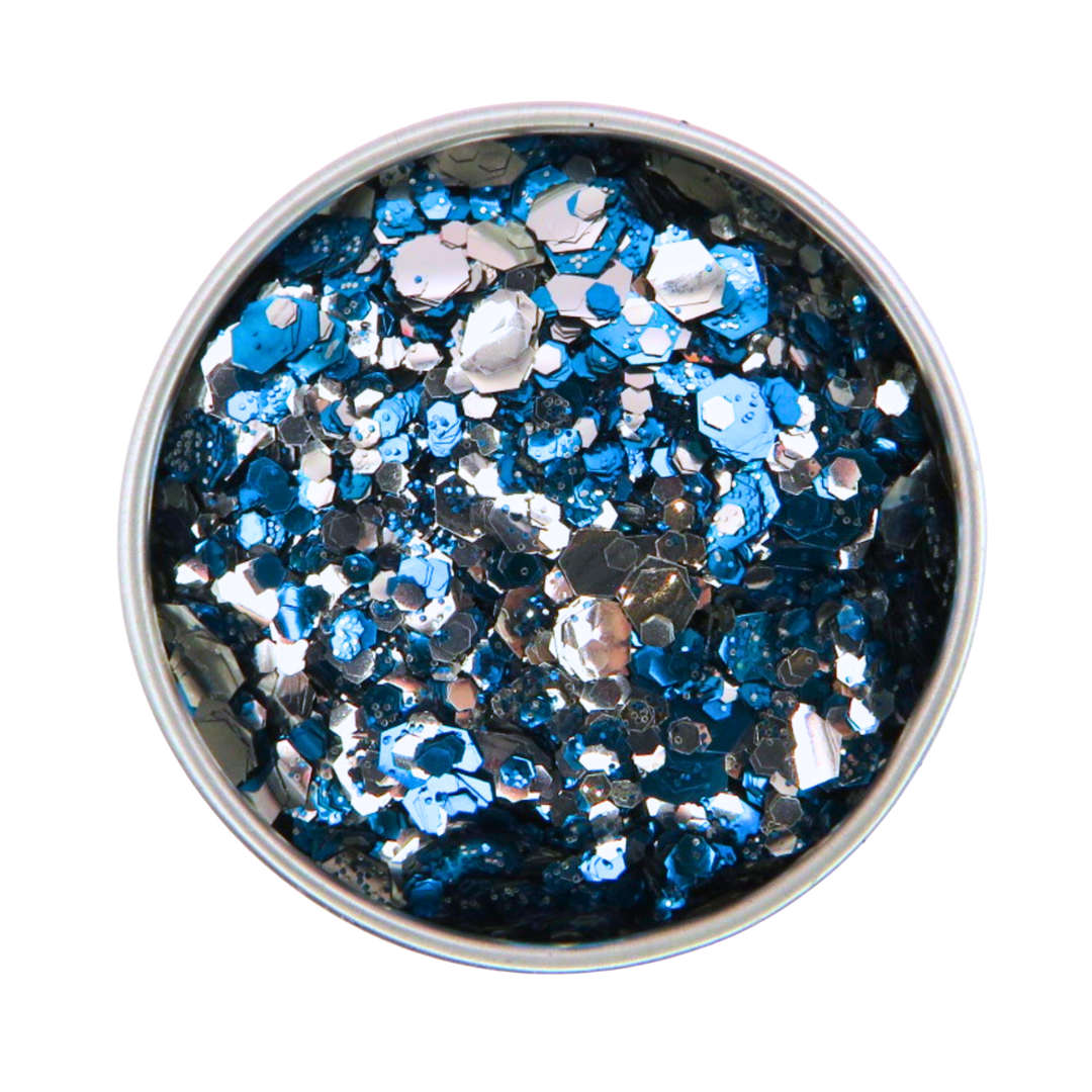 Metallic blue and silver glitter in a round container on a white background