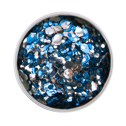 Metallic blue and silver glitter in a round container on a white background