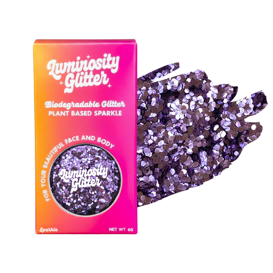 Luminosity Glitter packaging with purple glitter on a white background
