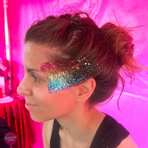 Rainbow face glitter look created with Luminosity eco glitter
