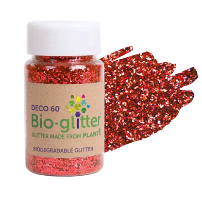 A jar of red craft Bio-glitter with a white cap and a kraft paper label, shown next to a textured swatch of the red glitter on a white background.