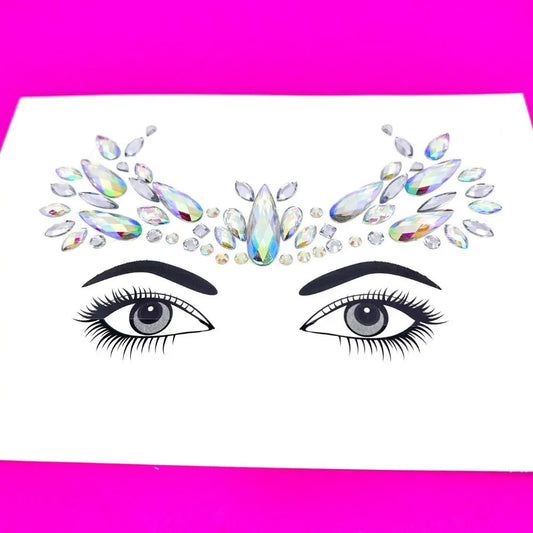 Reign face jewels to go on your forehead for festivals and parties. Holographic silver face gems.